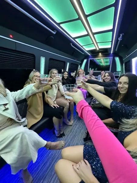 women making a toast in party bus